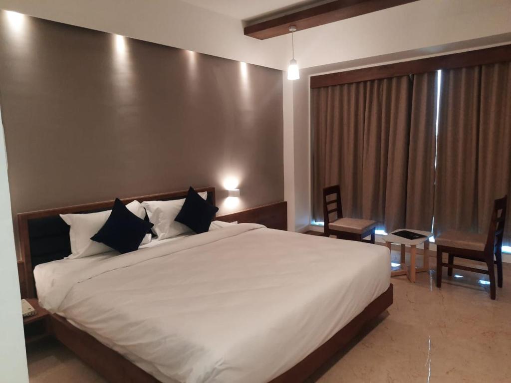 Elegance Room bed with premium headboard and linen